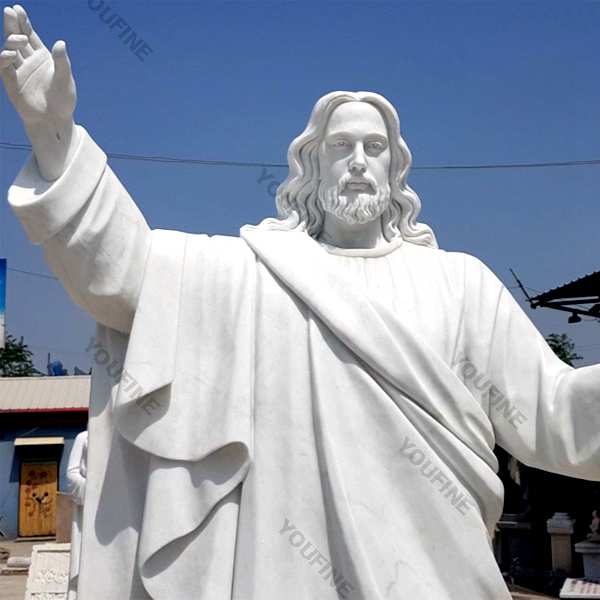 Outside Jaint catholic white marble church statues of christ Jesus making for parish garden